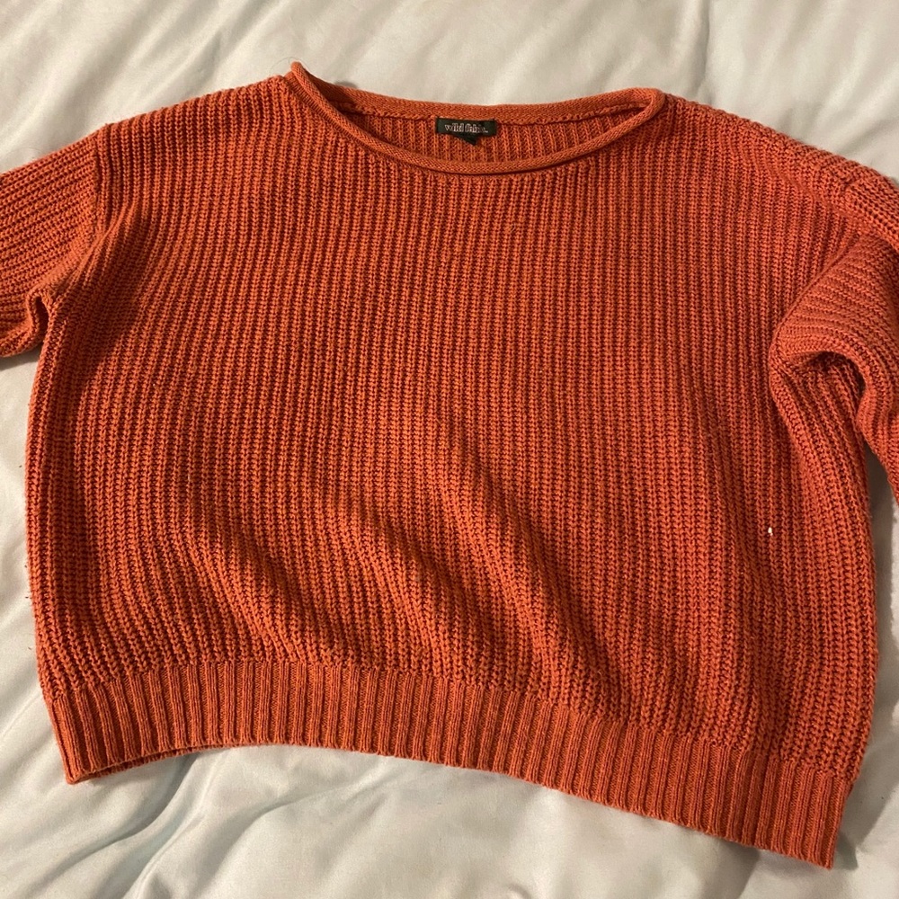 A cropped sweater